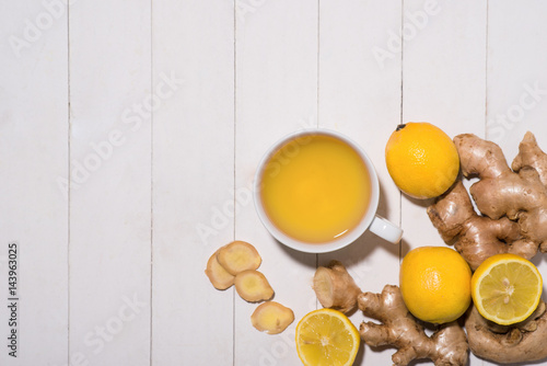 Healthy ginger tea ingredients on a wooden table