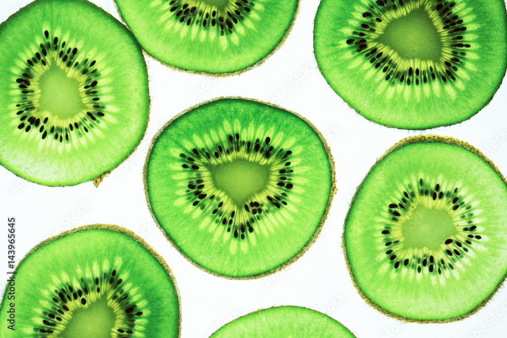Fototapeta premium Still life picture, Abstract fruit background is close up on Kiwi sliced, to show a detail on fresh kiwi face with white background