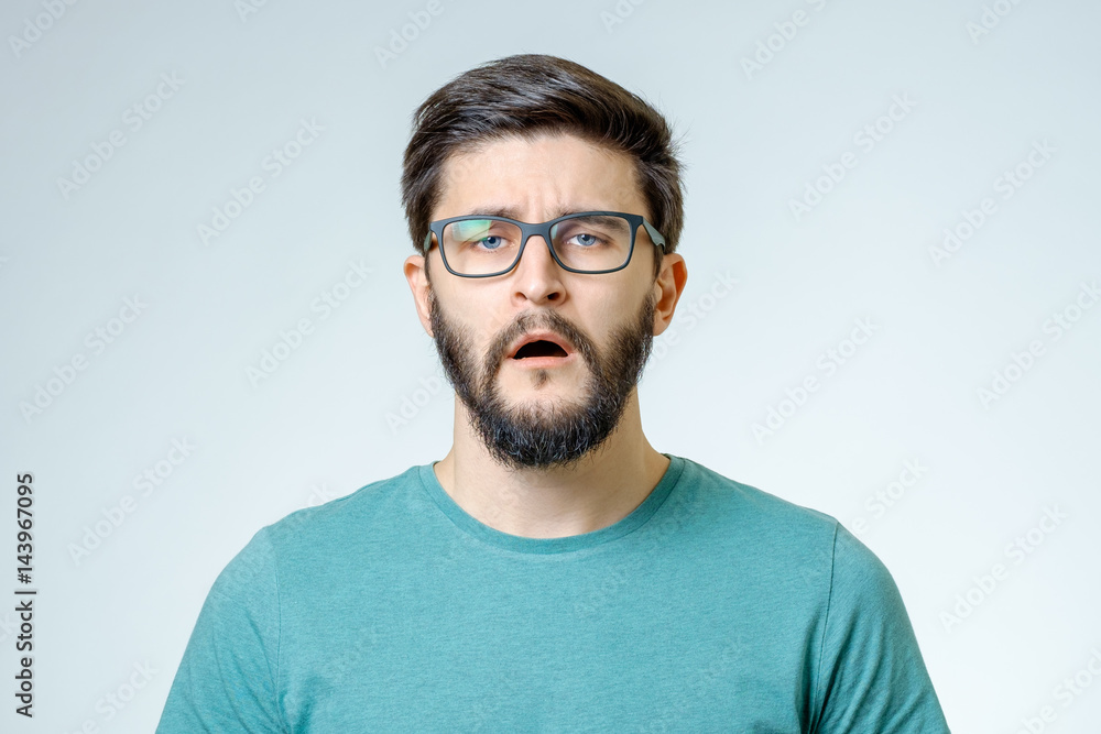 Portrait of young man with sad face expression Portrait of young man with sad face expression