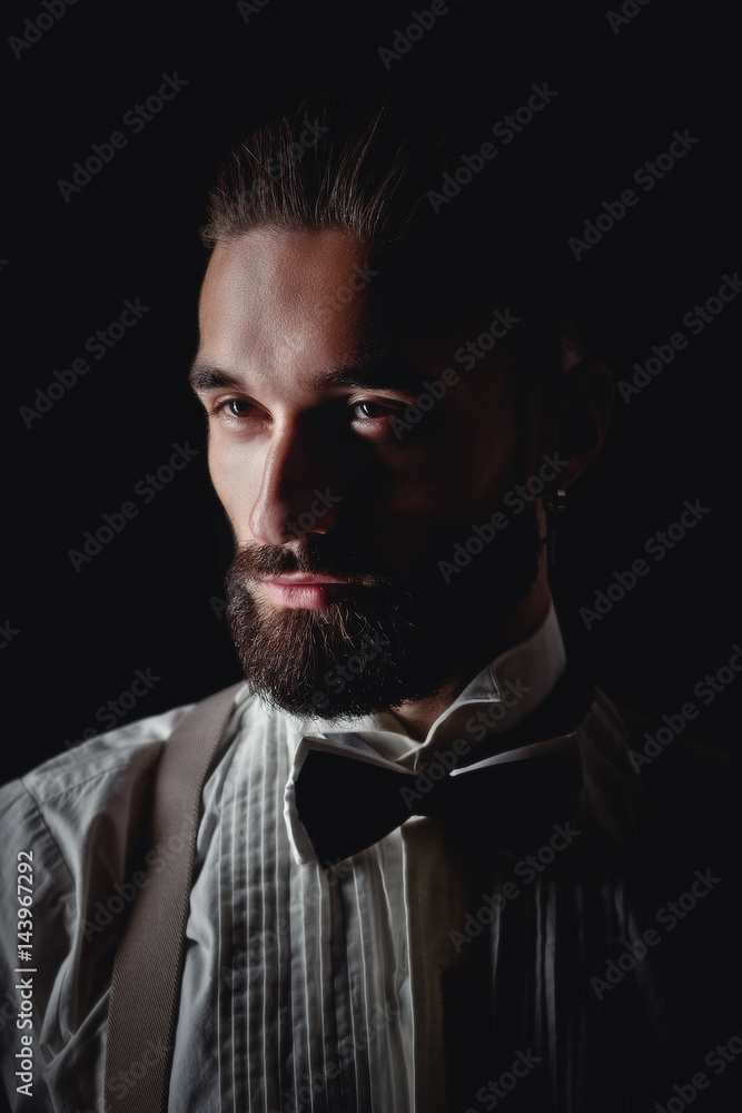 Portrait of handsome man posing for photographer in studio Portrait of handsome man posing for photographer in studio