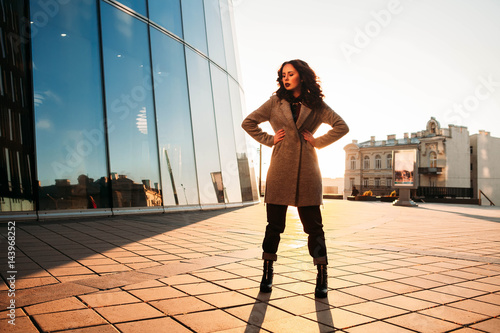 Business woman standing ing outside the office photo