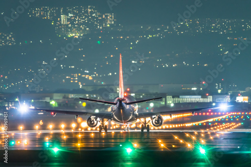 Airplane taking off in the night (夜の航空機離陸シーン)