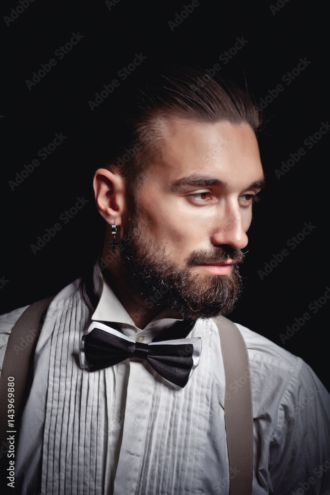 Portrait of handsome man posing for photographer in studio Portrait of handsome man posing for photographer in studio