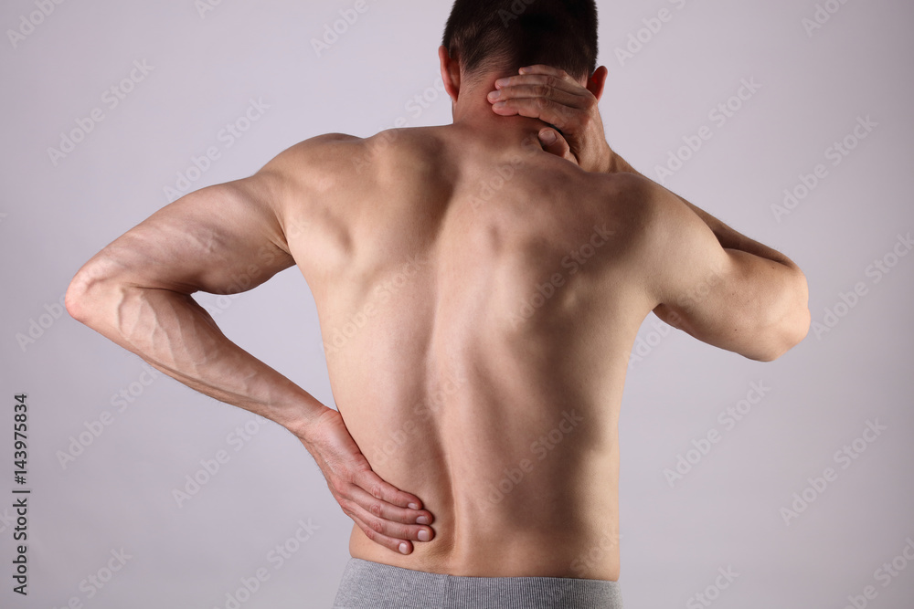 Fototapeta premium Sport injury, Man with back, neck pain. Pain relief and health care concept.