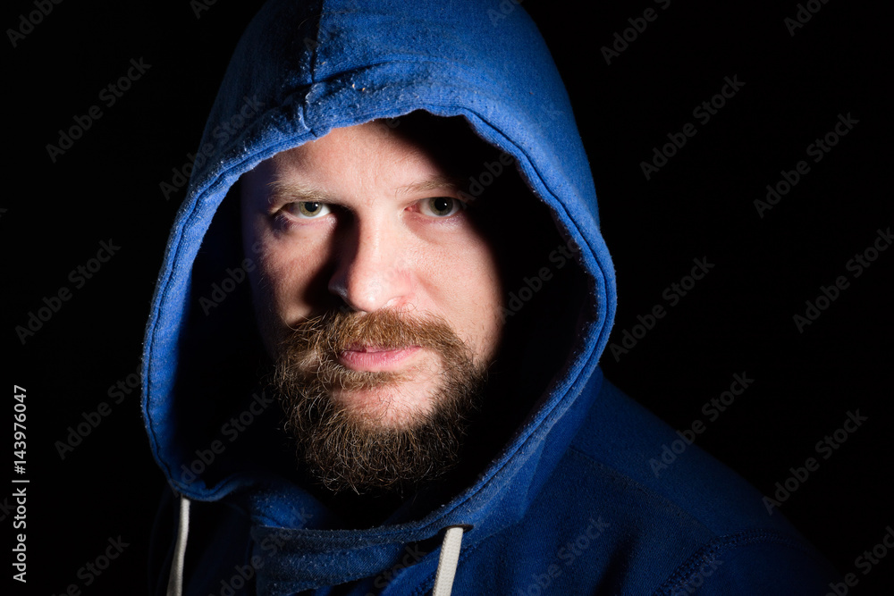 Solid bearded middle-aged man in a hood portrait Solid bearded middle-aged man in a hood portrait
