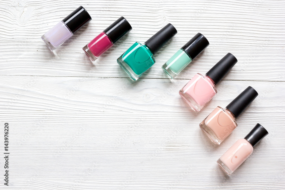 Bottles with nail polish over white background top view mockup Bottles with nail polish over white background top view mockup