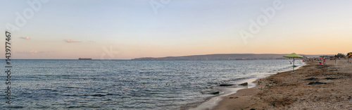 Sandy beach sunset panoramic view on the black sea