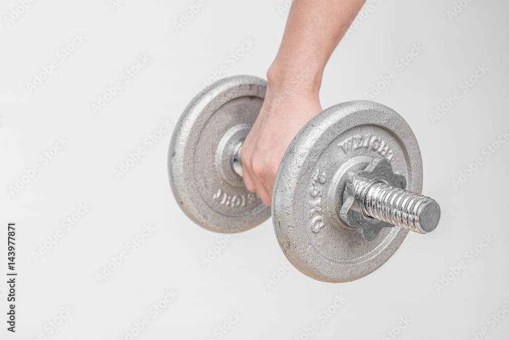 Fototapeta premium hand taking dumbbell for bodybuilder. Concept for sport player or workout. gym of accessories for fitness