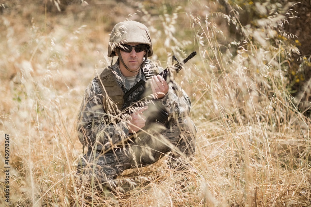 Military soldier guarding with a rifle Military soldier guarding with a rifle