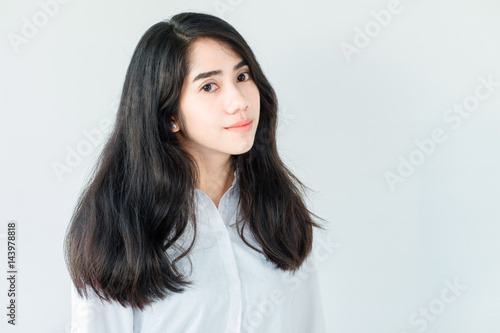 portrait of a beautiful young tender teenage girl and hipster asian woman model with Black hair posing in studio and showing different emotions . Laughing, smiling, anger, suspicion, fear, surprise.