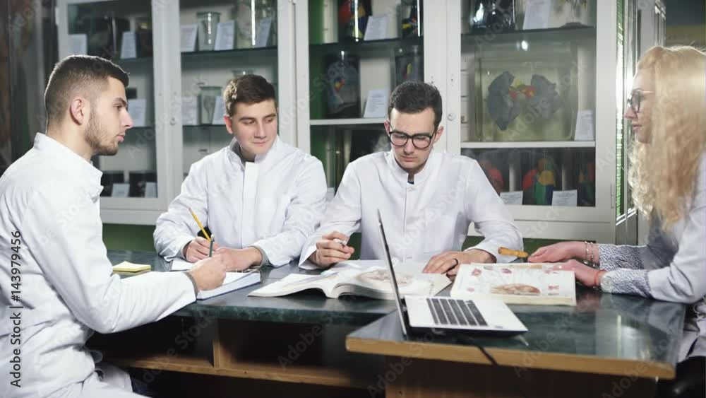 Four young doctors having Four young doctors having