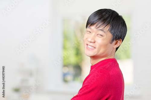 Handsome young asian man smiling