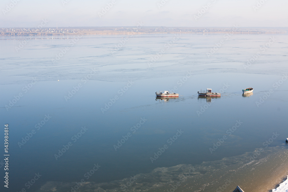 A few small ships in the sea near coast A few small ships in the sea near coast