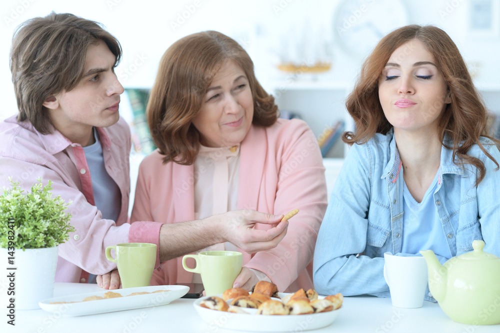 Happy family drinking tea together Happy family drinking tea together