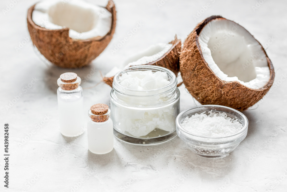 cosmetic concept with fresh coconuts on white table background cosmetic concept with fresh coconuts on white table background