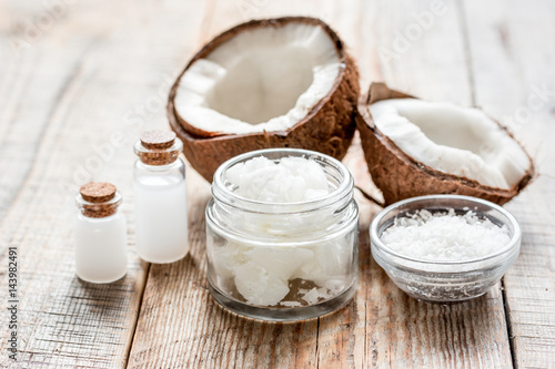 coconut oil for body care in cosmetic concept on old wooden table