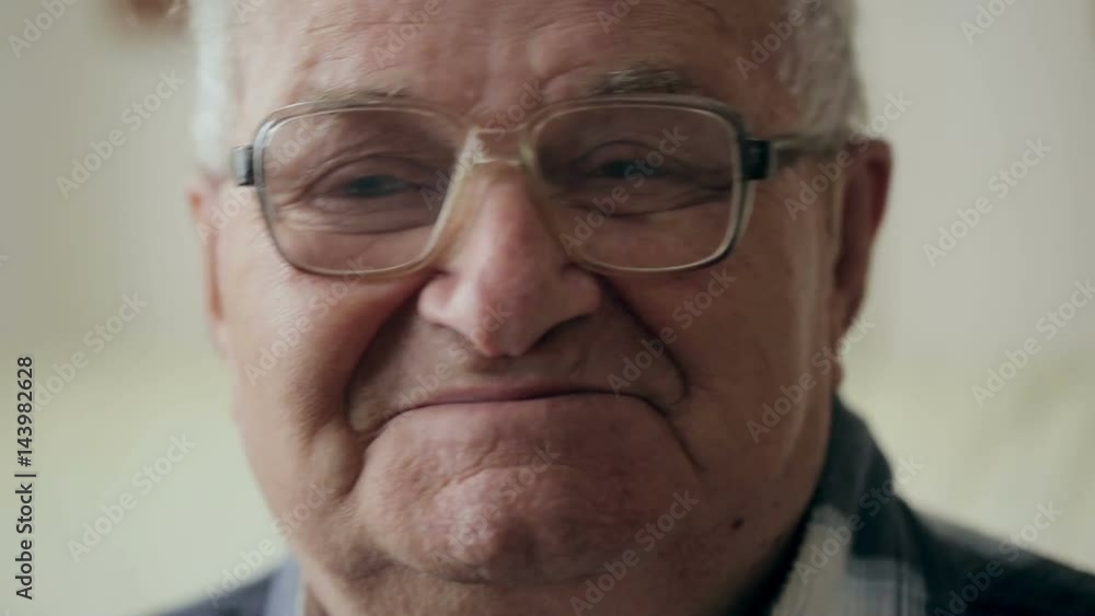 Portrait of Old Man. Grandfather with glasses looks at the camera and smiles. Portrait of Old Man. Grandfather with glasses looks at the camera and smiles.