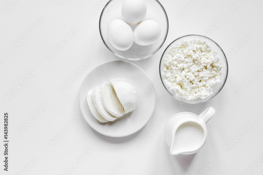 Fototapeta premium monochrome concept with dairy products on white table top view mockup