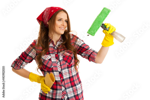 Happy young woman cleaning windows isolated over white vackground