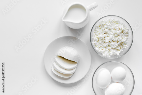 monochrome concept with dairy products on white table top view mockup