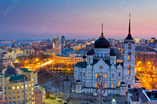 Evening Voronezh. Tower of management of south-east railway in the style of Stalin's empire and Annunciation Cathedral at sunset background  © Mulderphoto