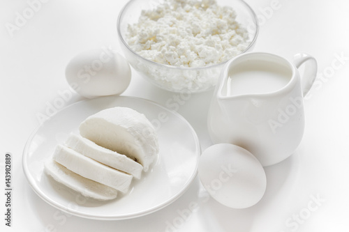 dairy products for proteic meal on white table background