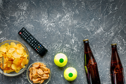 snacks for watching sport match on dark background top view mock-up