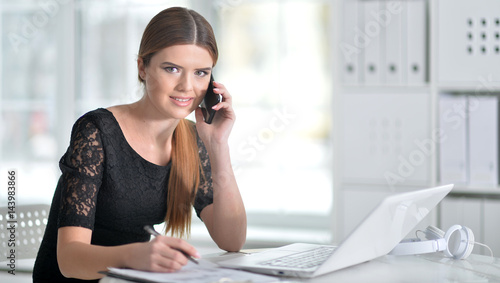 Business woman sitting at table 
