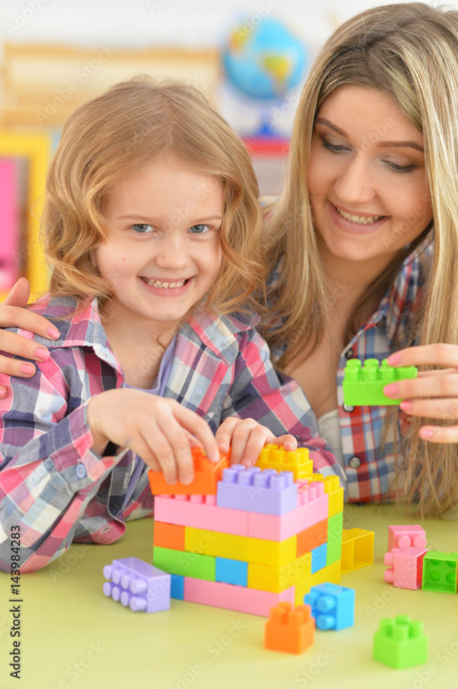 Mother and daughter having fun playing Mother and daughter having fun playing