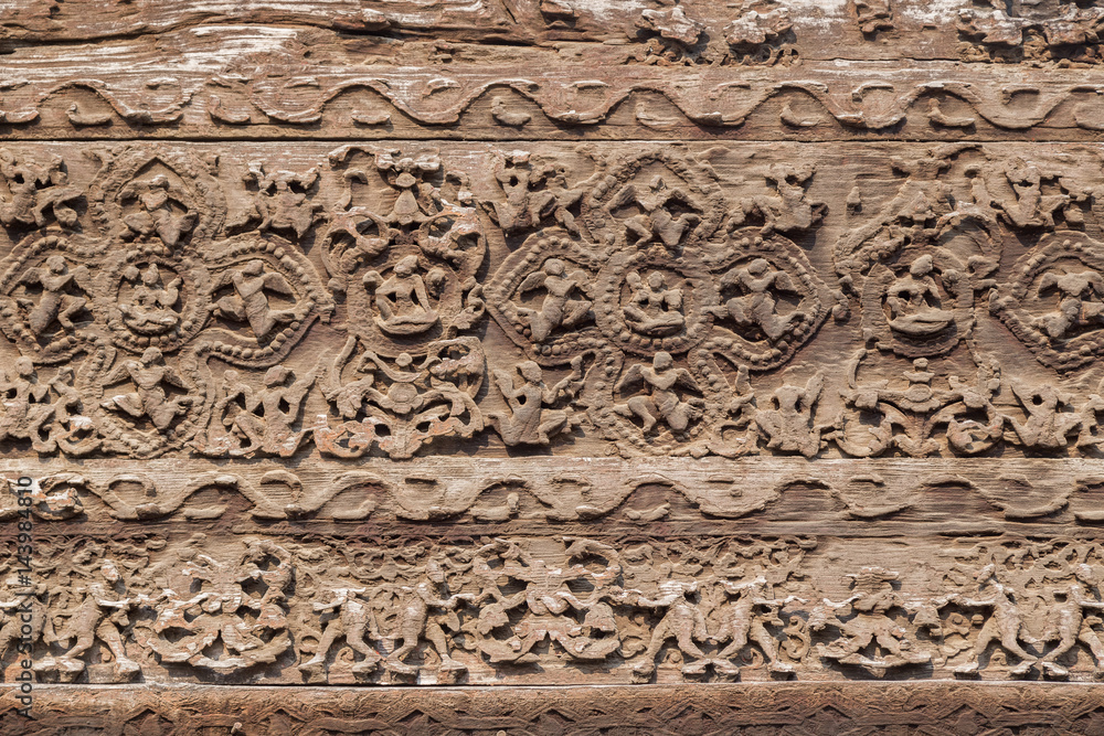 Close-up of beautiful wood carvings at the wooden Shwenandaw Monastery (also known as Golden Palace Monastery) in Mandalay, Myanmar (Burma).