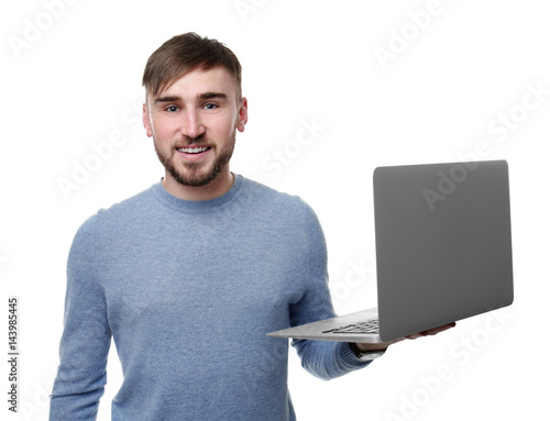 Young programmer holding la...