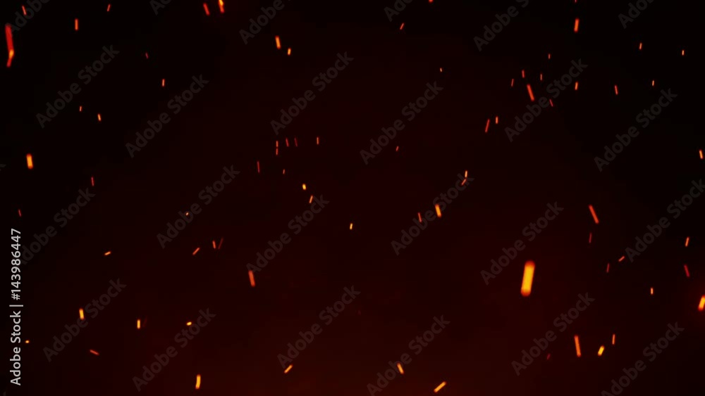 Firestorm texture. Bokeh lights on black background, shot of flying fire sparks in the air