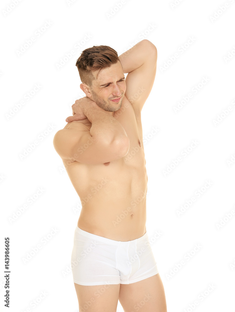 Young man suffering from neck pain on white background