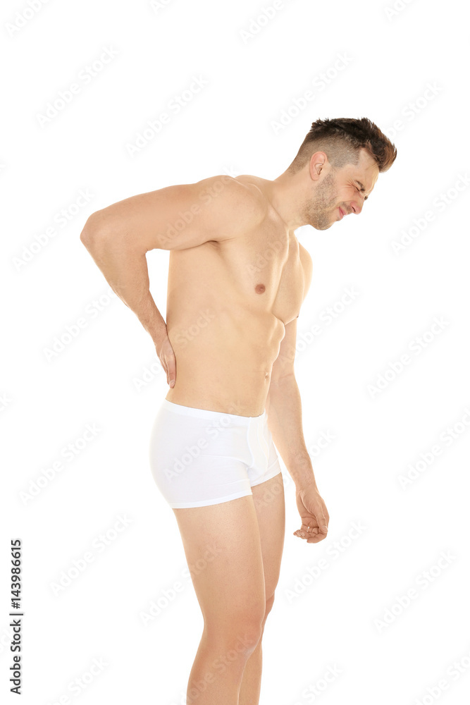 Young man suffering from back pain on white background Young man suffering from back pain on white background