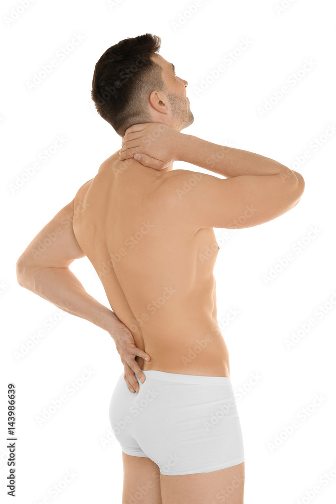 Fototapeta premium Young man suffering from back pain on white background