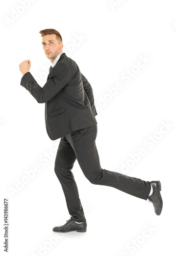 Handsome running businessma...