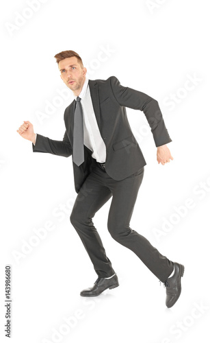 Handsome running businessma...