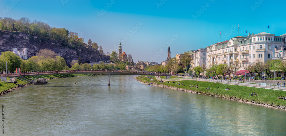 Fototapeta premium Salzburg, Austria.Panoramic view of Salzburg with Salzach river during sunny spring day