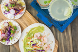 Shrimp tacos with guacamole.