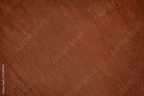 Old dark brown varnished wood close up