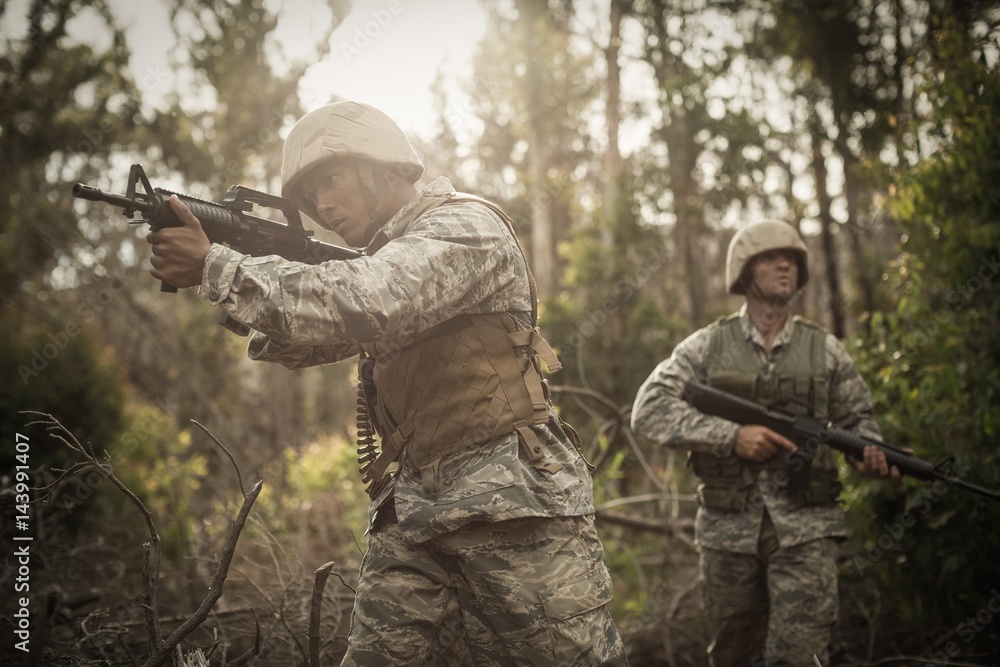 Fototapeta premium Military soldiers during training exercise with weapon