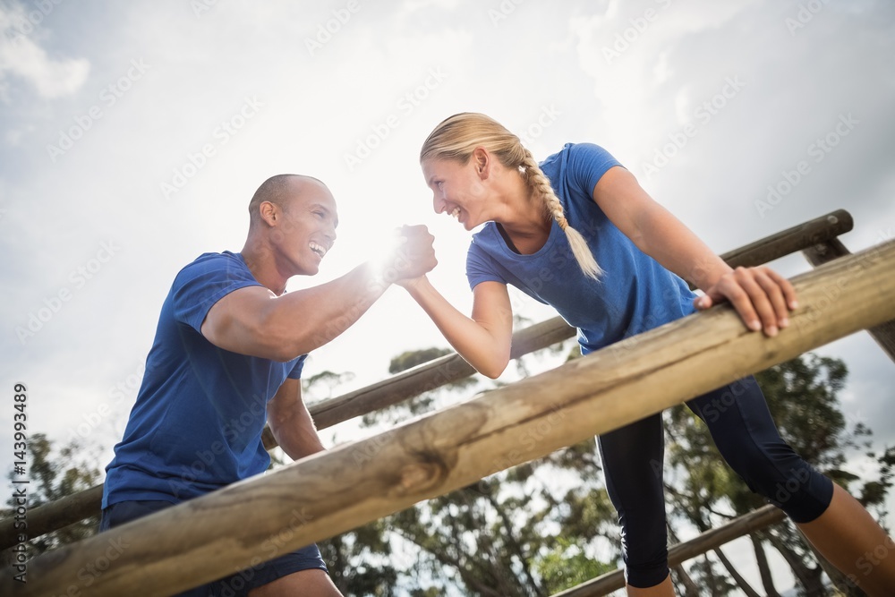 People jumping over the hurdles during obstacle course People jumping over the hurdles during obstacle course