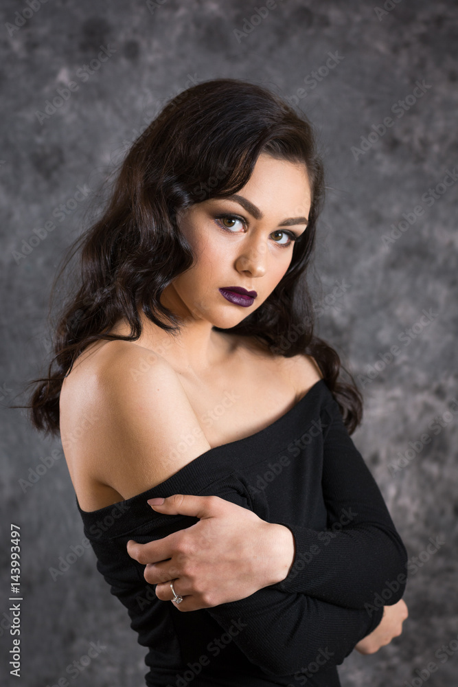 Portrait of a young woman, elegant with long brunette hair Portrait of a young woman, elegant with long brunette hair