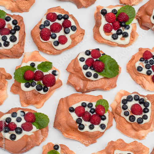 Pavlova dessert with raspberries and blueberries