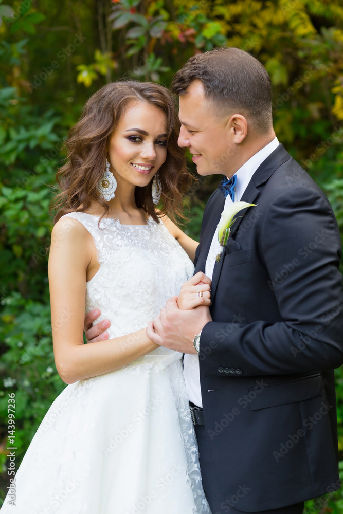 Elegant curly bride and stylish groom Elegant curly bride and stylish groom