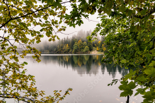 Italy, Trentino Alto Adige, Non valley, autumn reflections at Tovel Lake photo