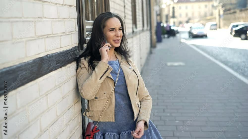 Young, pretty woman talking on cellphone in city
Young, pretty woman talking on cellphone in city