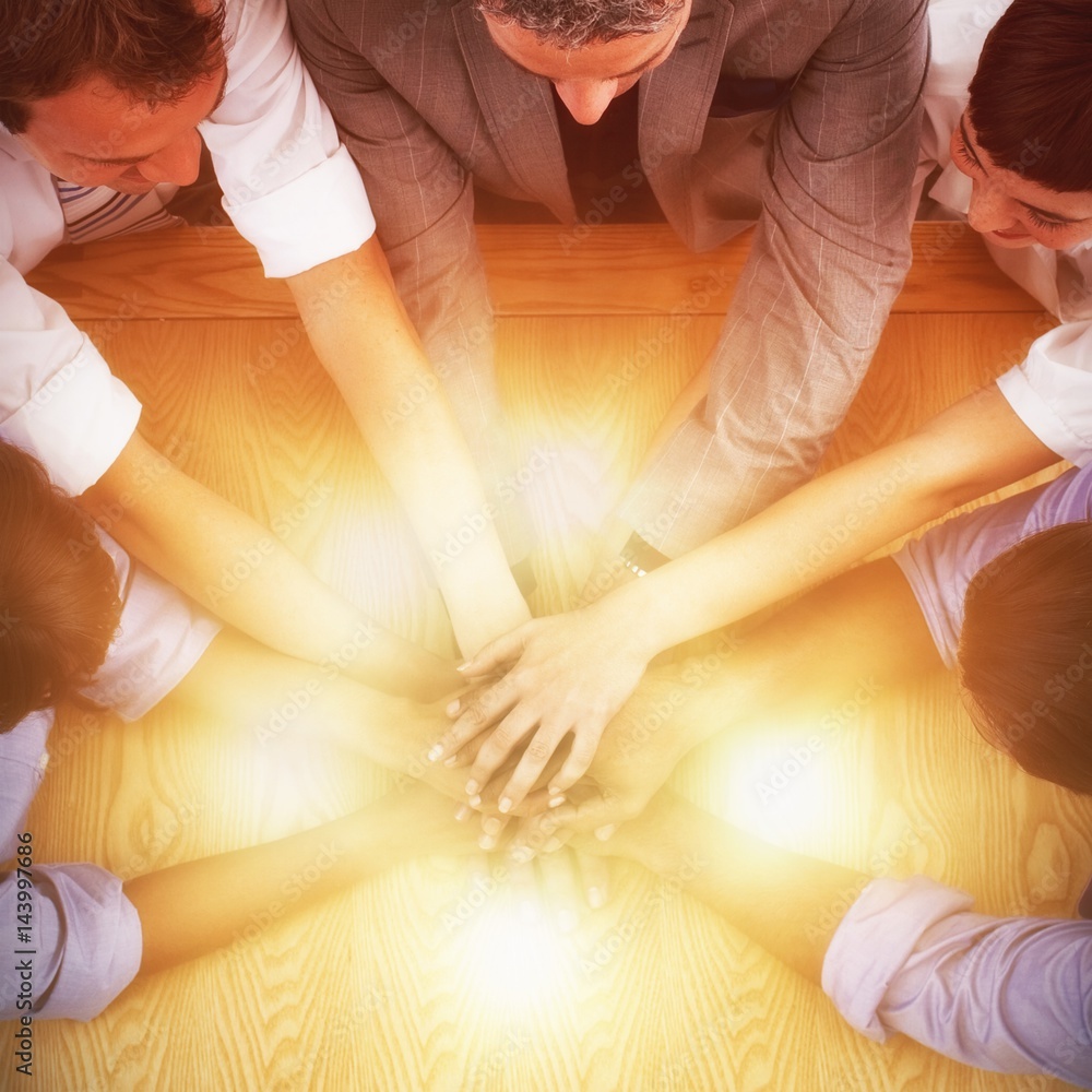Obraz premium High angle view of business team stacking hands