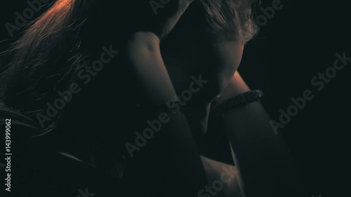 Unhappy sad teen girl. Domestic violence and abuse concept. 60 to 24fps UHD photo