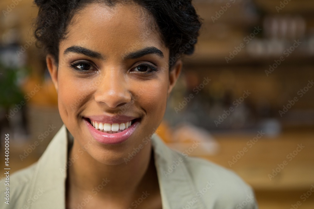 Portrait of smiling young woman in coffee shop Portrait of smiling young woman in coffee shop